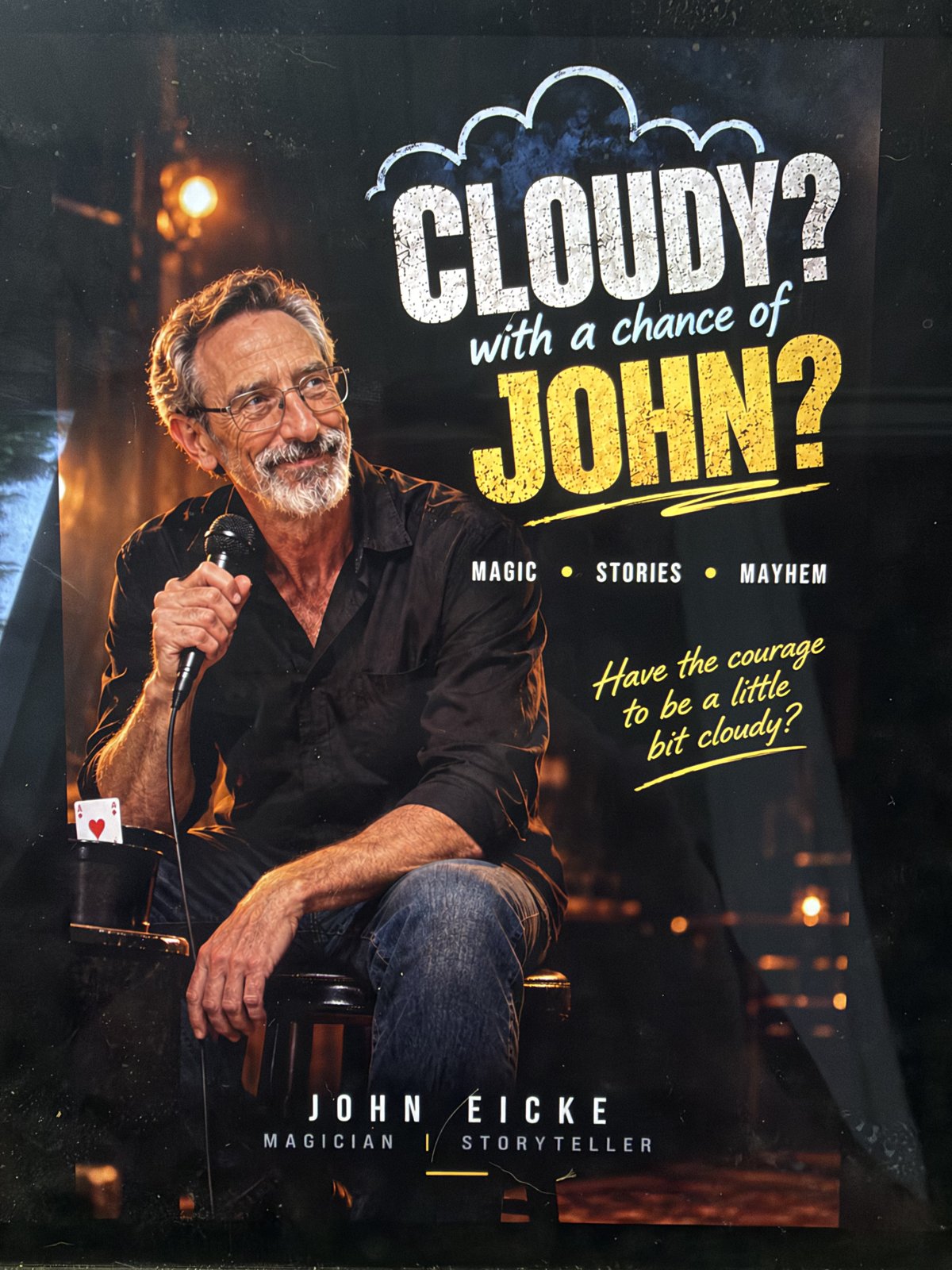 Cloudy? With a chance of John? Magic, stories, mayhem. John Eicke holding a microphone. Have the courage to be a little bit cloudy?